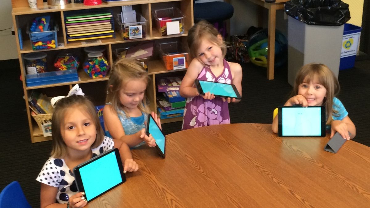 Preschoolers at KidsU at at University of Houston-Clear Lake with their iPads.