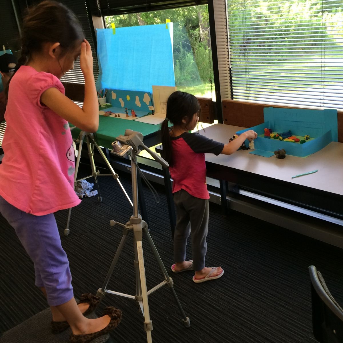 Young children at KidsU at University of Houston-Clear Lake create claymation with digital photography.