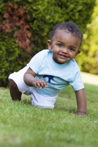 smiling small boy on grass