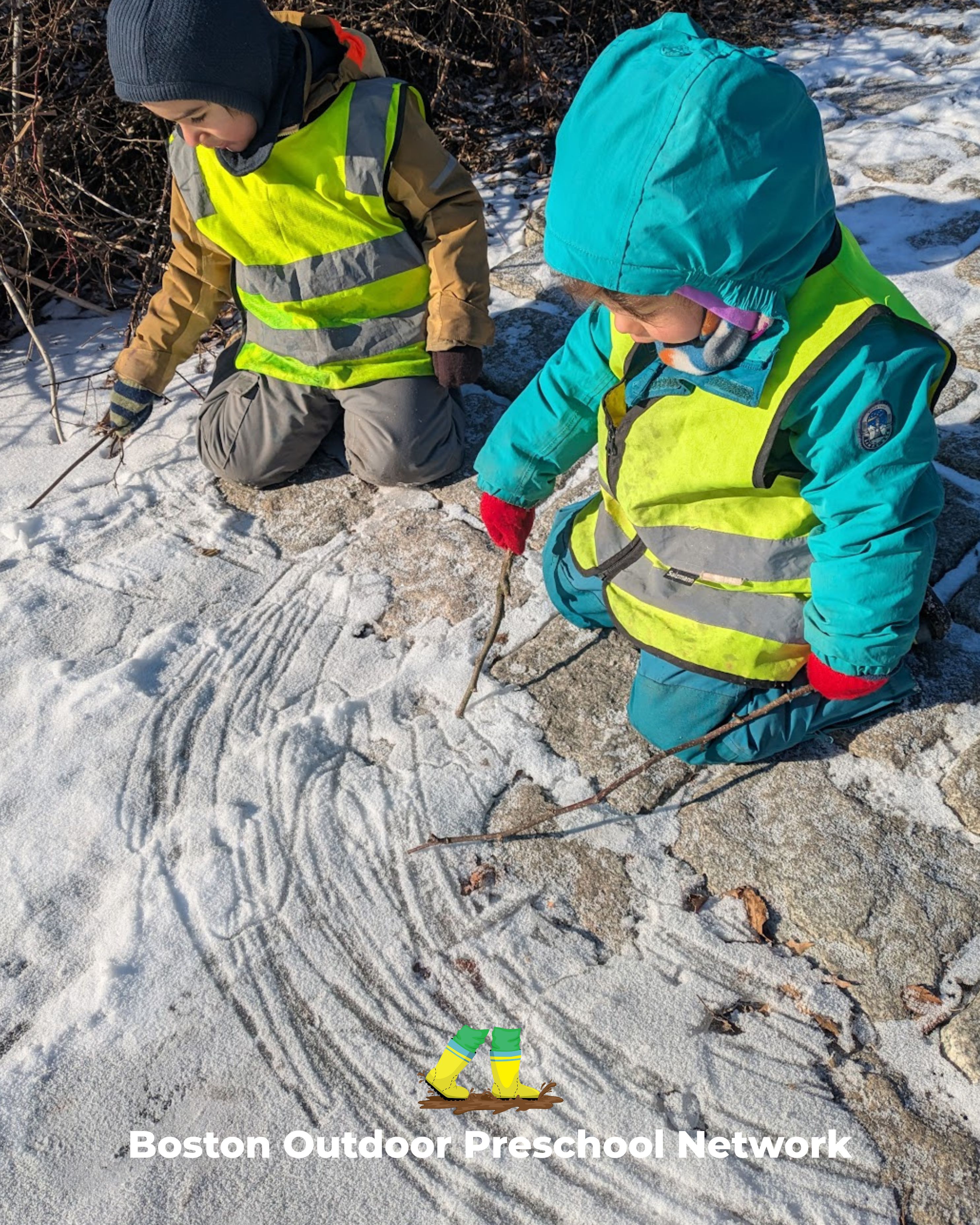 children writing in the snow with sticks