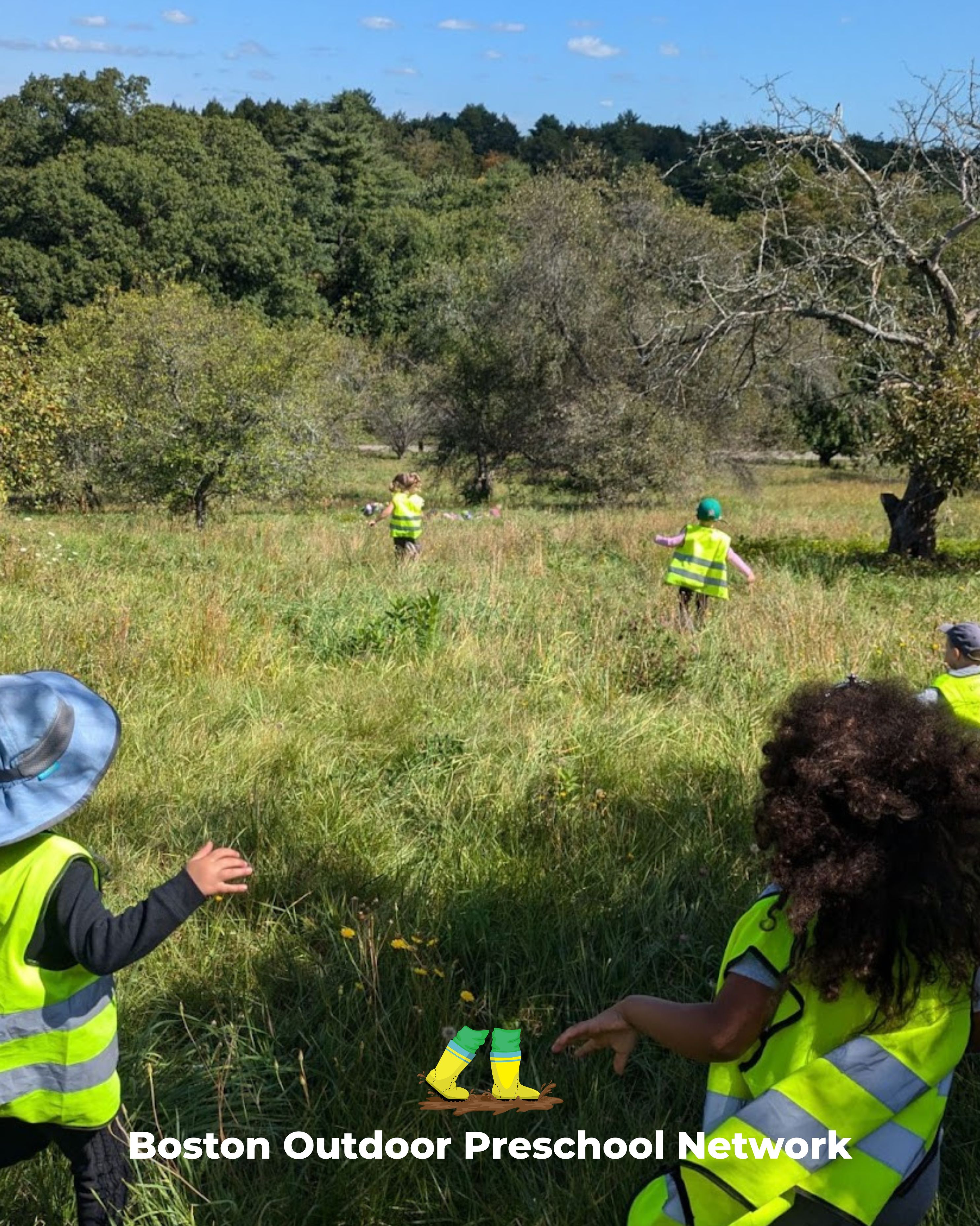children frolicking in a field
