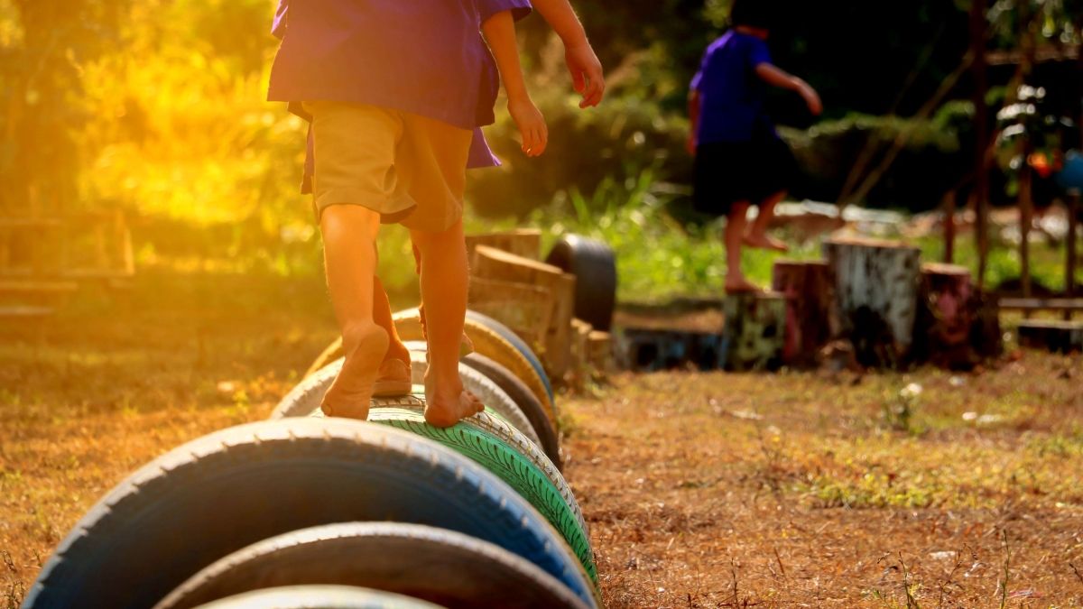 children walking on painted tires