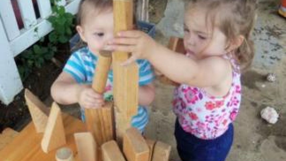 two children with building blocks