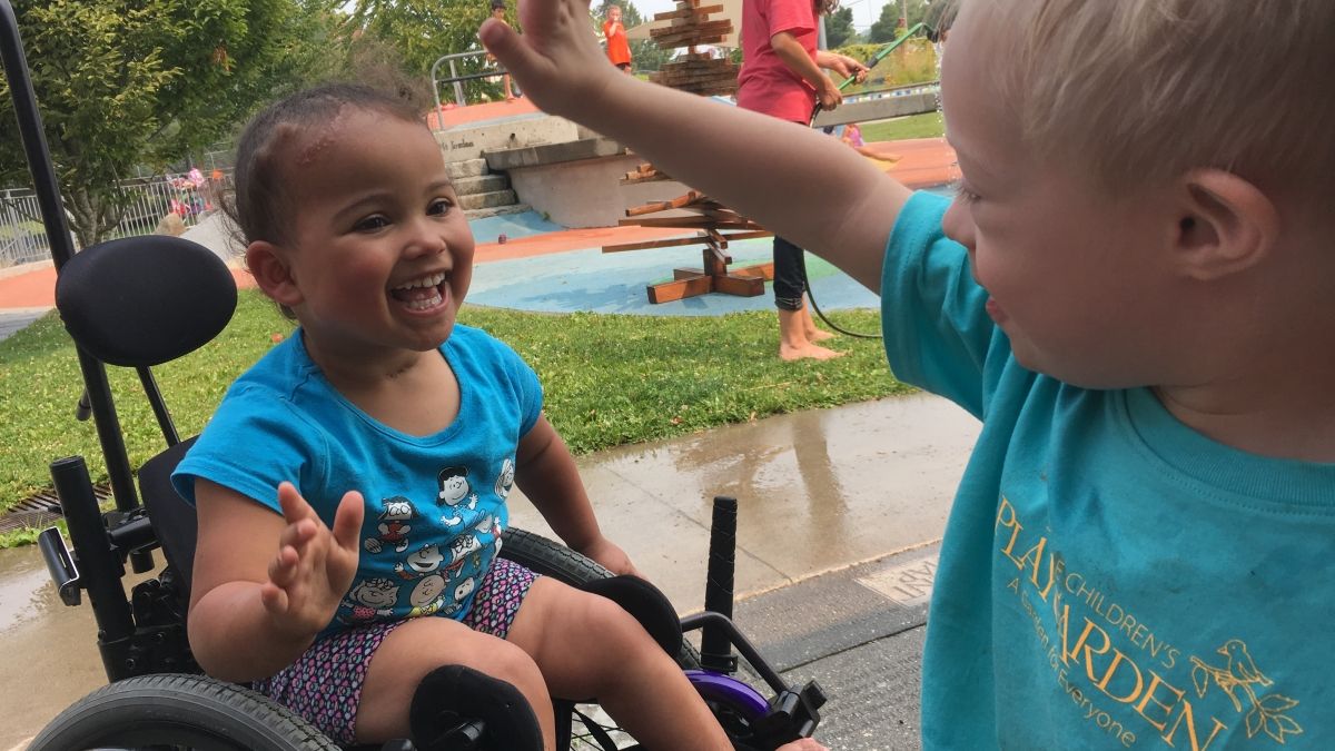 children giving high fives