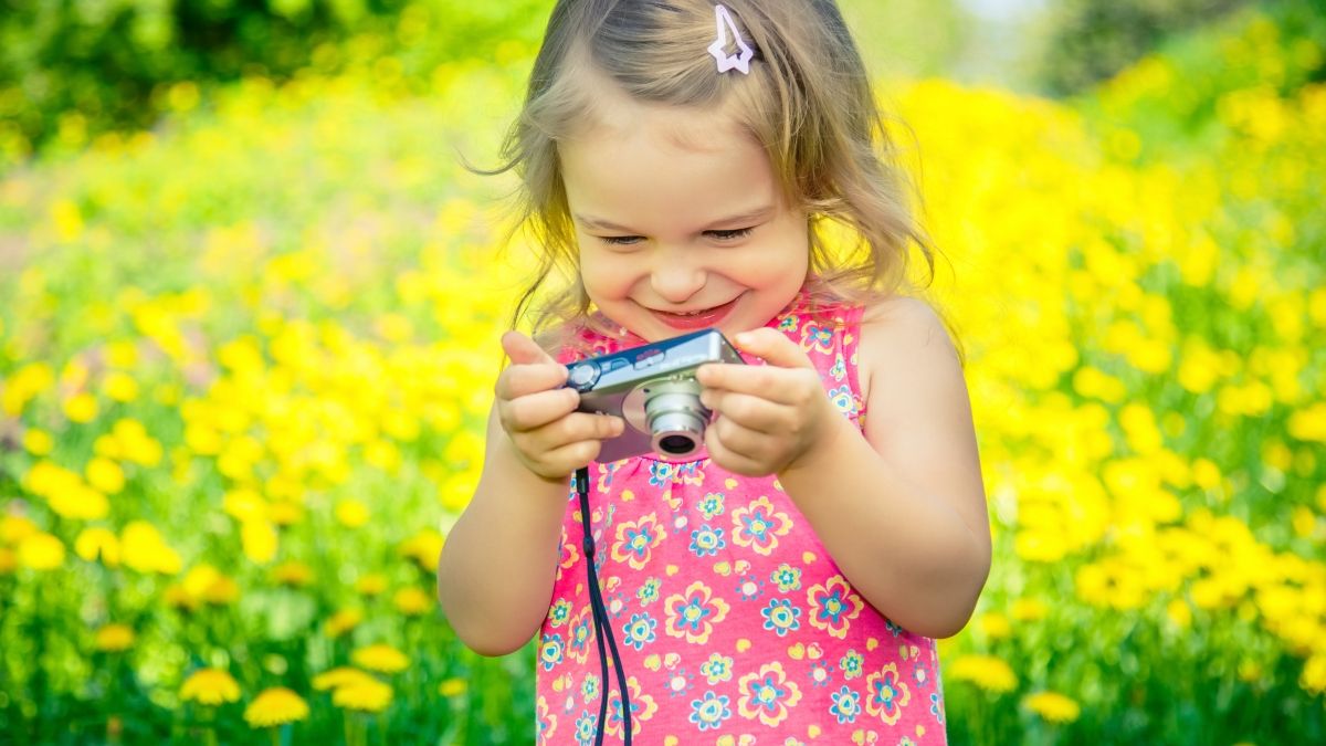 young girl with camera
