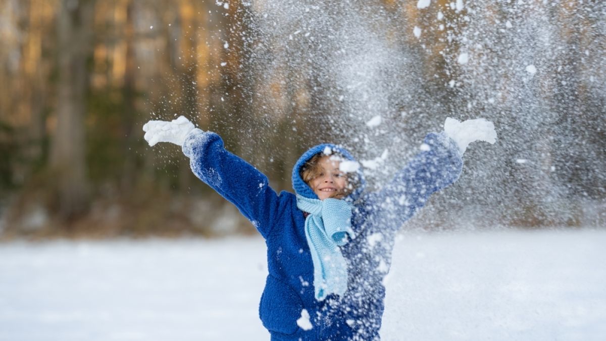 Child playing in snow