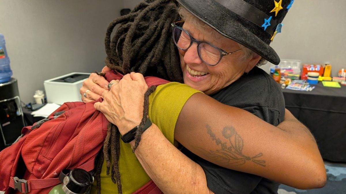 Betty Olivolo and Sydney Gary hugging 
