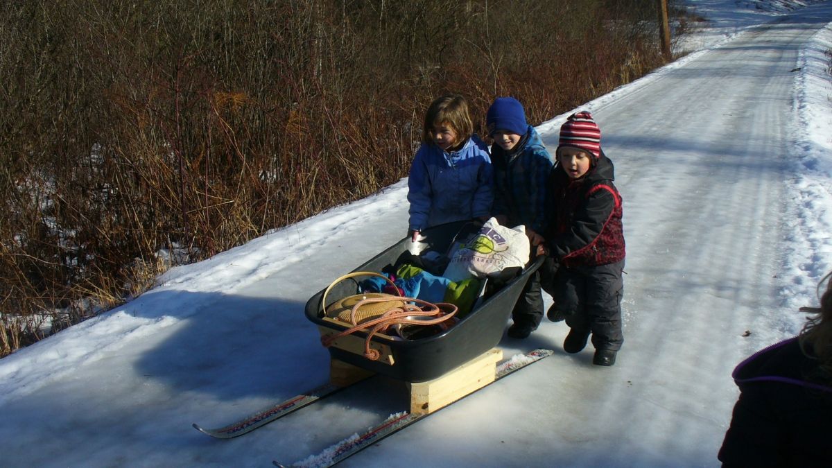Wild Roots students transport supplies using their ski-sled.