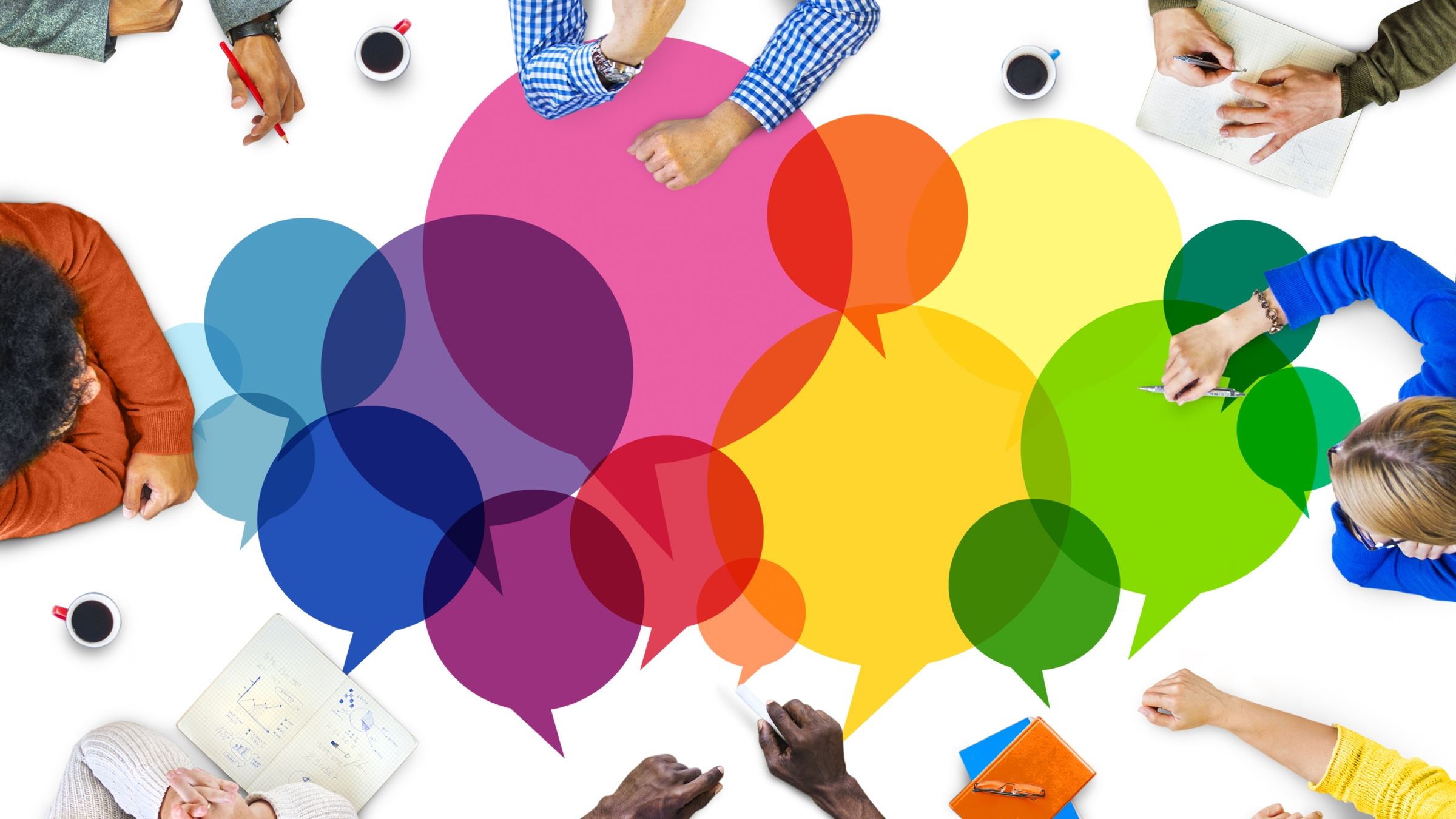 colorful thought bubbles with people at a conference table