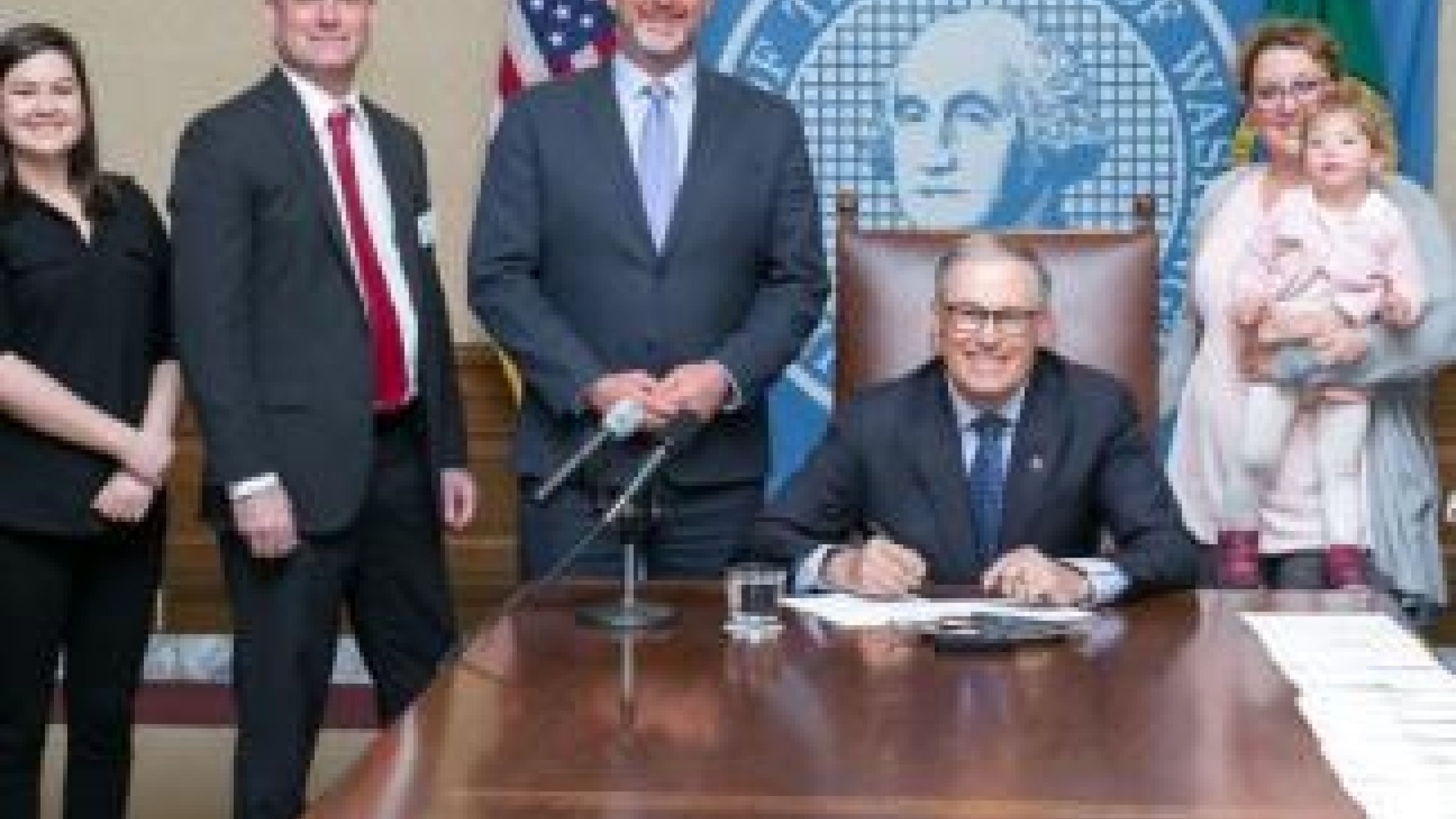 Senator Ranker and Governor Jay Inslee signing WA state signing licensing outdoor preschools