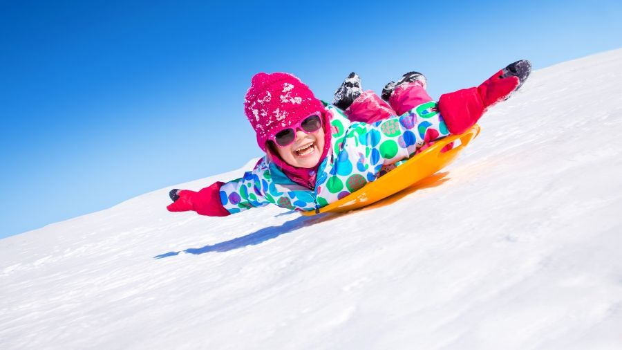 sledding down the hill
