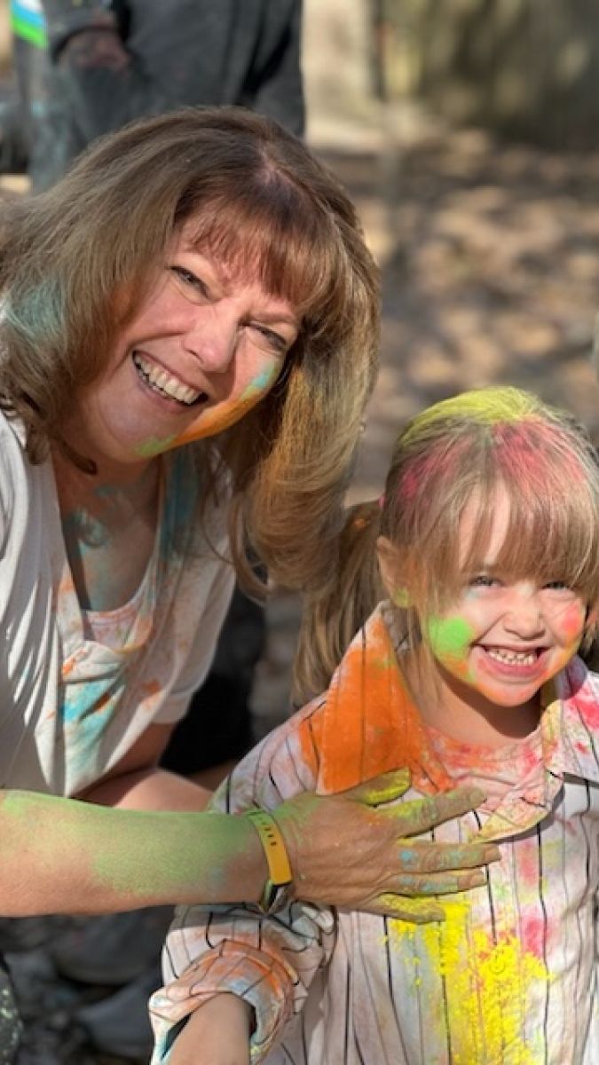 Debby Kinman-Ford with student smiling at camera