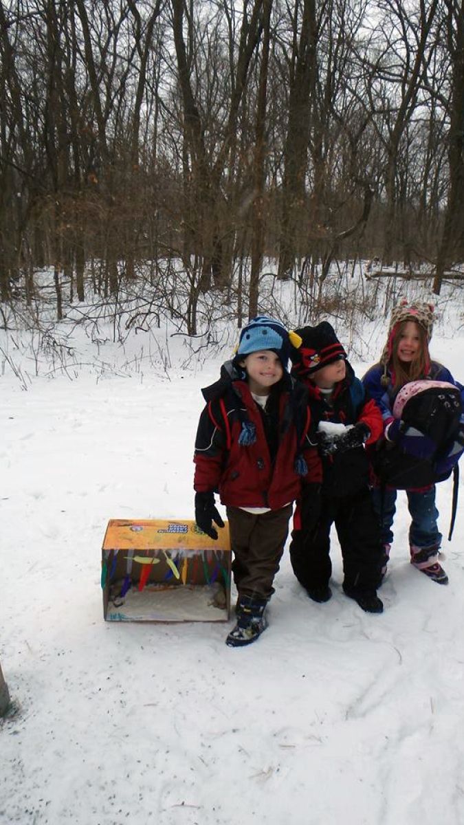 Children show off one of the bait boxes