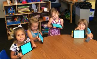 Preschoolers at KidsU at at University of Houston-Clear Lake with their iPads.