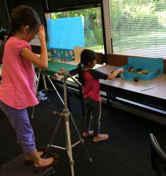 Young children at KidsU at University of Houston-Clear Lake create claymation with digital photography.