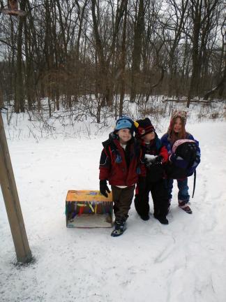 Children show off one of the bait boxes