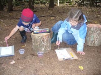 Wild Roots students journaling outdoors.