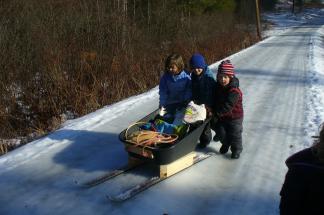 Wild Roots students transport supplies using their ski-sled.