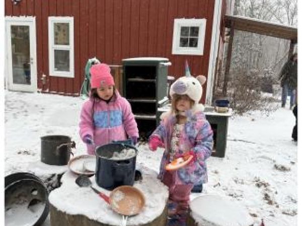 children playing kitchen in the snow