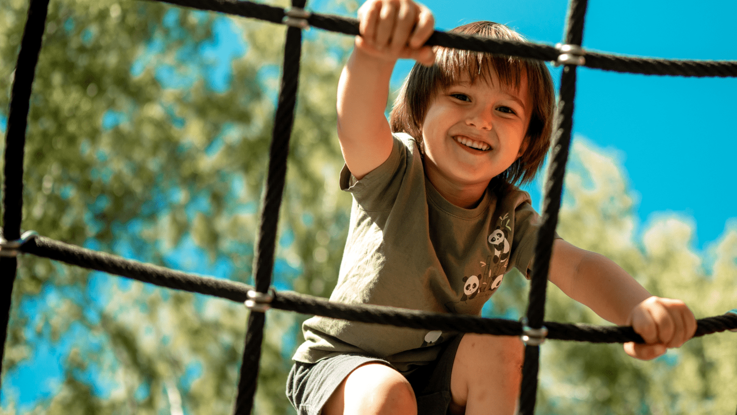 child climbing alpine grid
