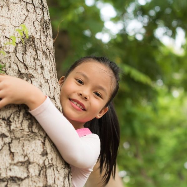 girl hugging tree