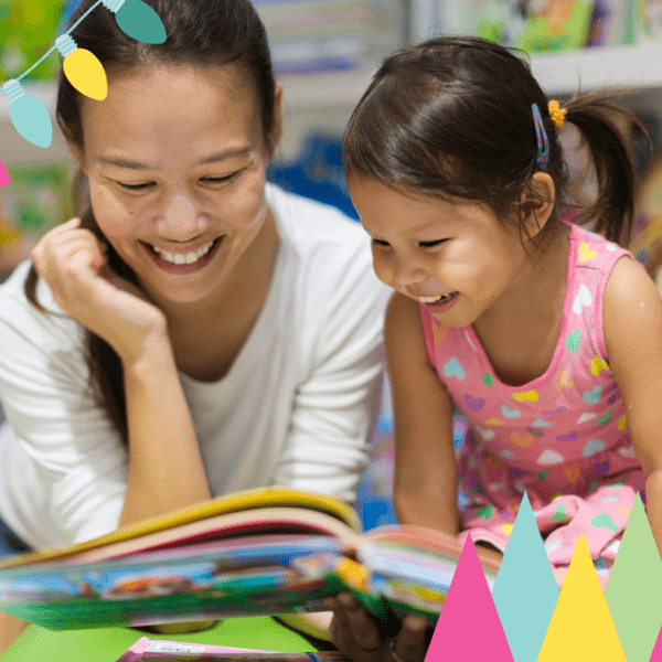 mother with child looking at book at book fair
