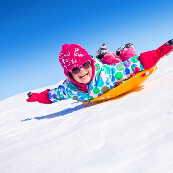 sledding down the hill